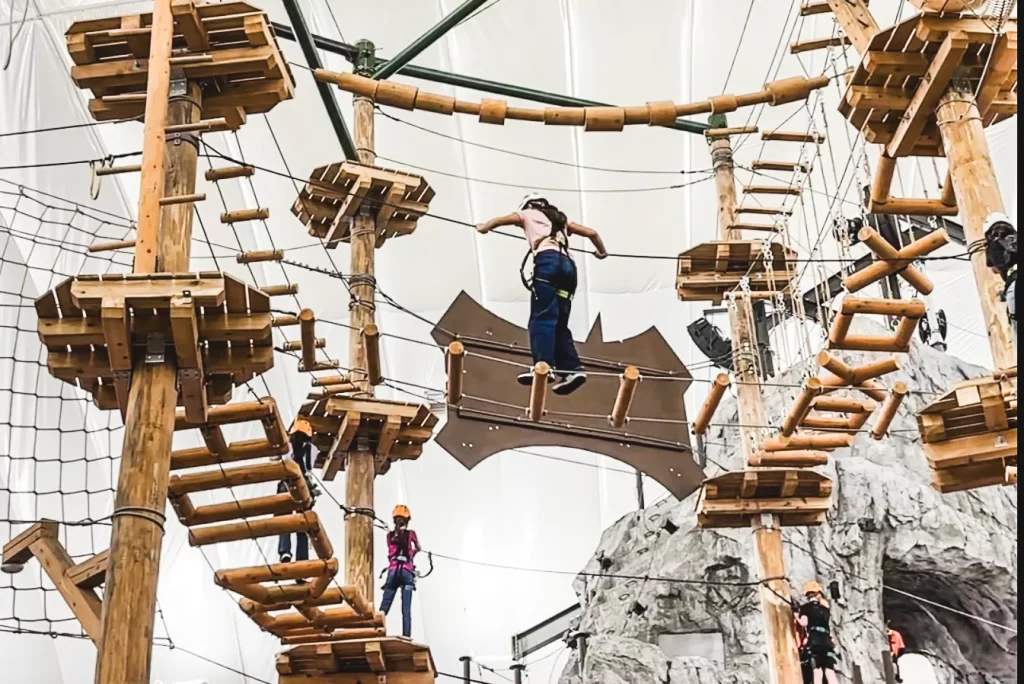 Person walking the Ropes Course in Bolder Adventure Park at Gran Prairie's Epic Central